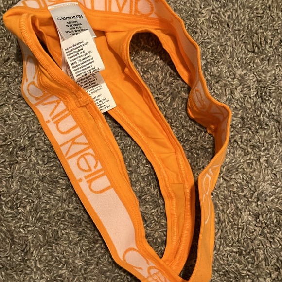 NWOT Calvin Klein Orange Thong Panty size Small - Picture 2 of 4